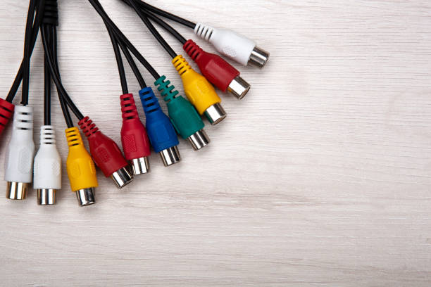 istock colored audio wires tulips on wooden background top view 1309300841