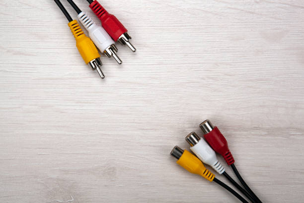istock colored audio wires tulips on wooden background top view 1309300870