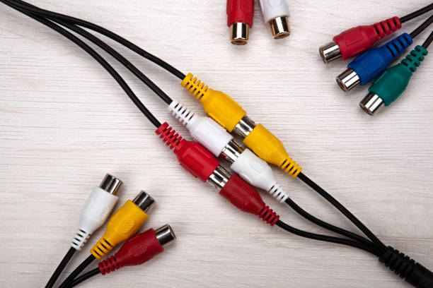 istock colored audio wires tulips on wooden background top view 1309300985