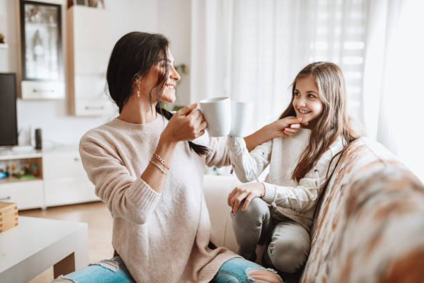 Hot Drink Time For Mother And Daughter At Home