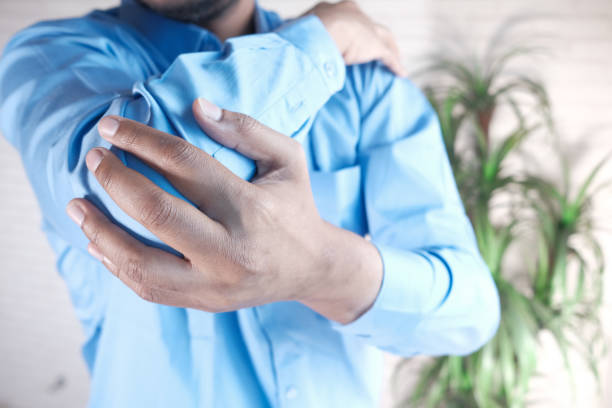 istock man with elbow pain, pain relief concept. 1309303990