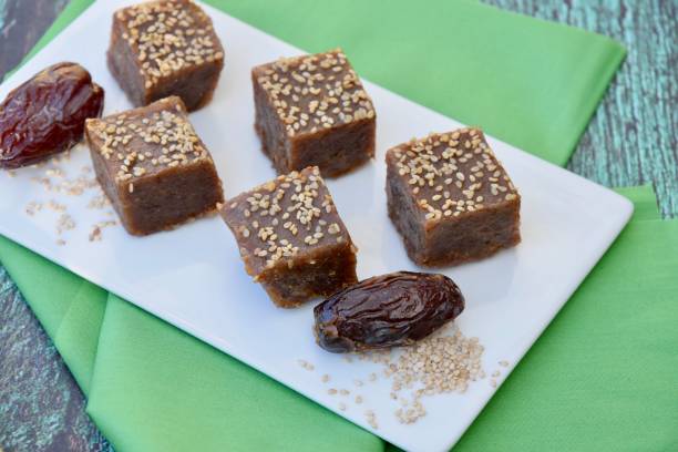 istock Tahini dates square bites topped with sesame seeds. 1309304299