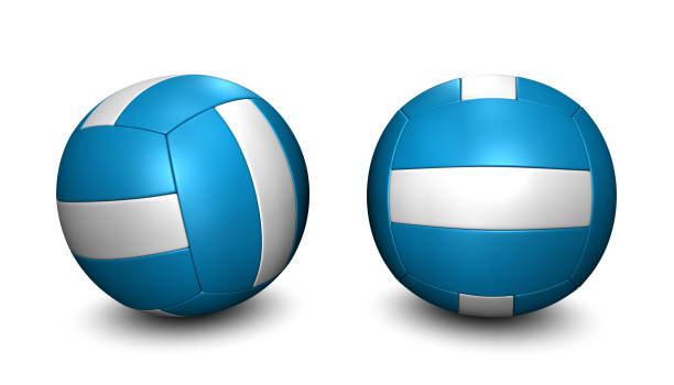 A used leather volleyball resting on a wood gym floor.