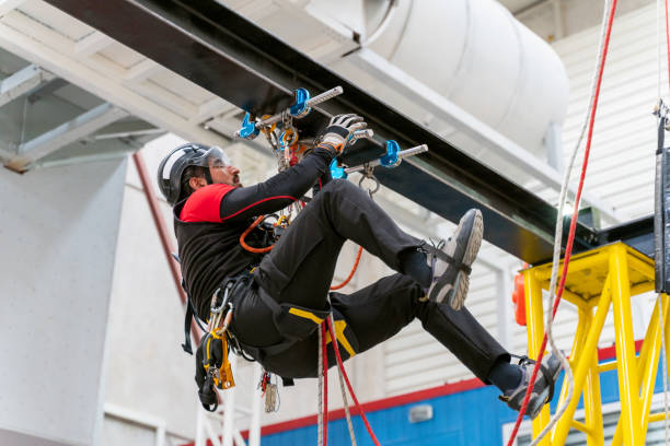 istock Young man in training with climbing equipment 1309306825