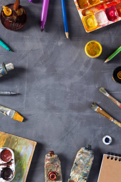 istock Paintbrush and tubes with painter tools at abstract table background texture. Art painter concept 1309309274