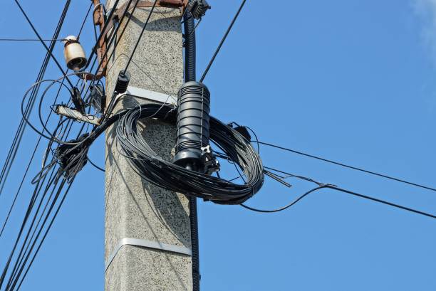 istock electrical wires and black box on a gray concrete pillar 1309313121