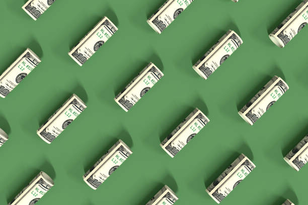 istock Rolled up dollar bills lie on a green surface. Creative money pattern. 3d illustration. 1309314967