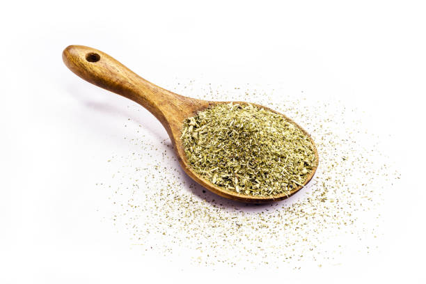 istock wooden spoon with yerba mate on isolated white background 1309316372
