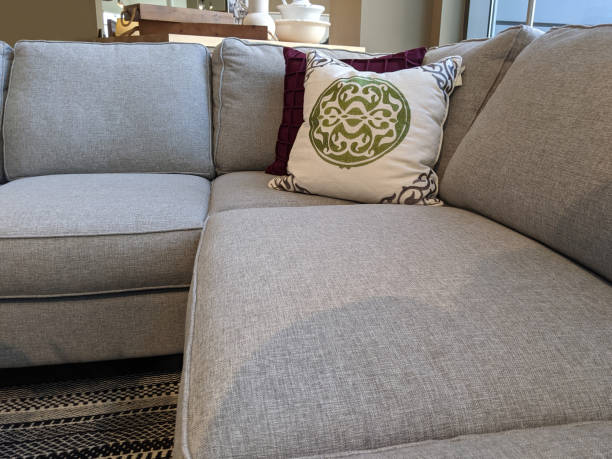 istock view of several pillows piled on a light colored couch in a living room 1309316504
