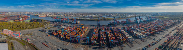 Panorama aerial view of seaport on the river Elbe in Hamburg. View of the container terminal in Hamburg-Altenwerder, loading and unloading of various shipping container and the Hamburg freight station Loading and unloading of various shipping container and the Hamburg freight station köhlbrandbrücke stock pictures, royalty-free photos & images