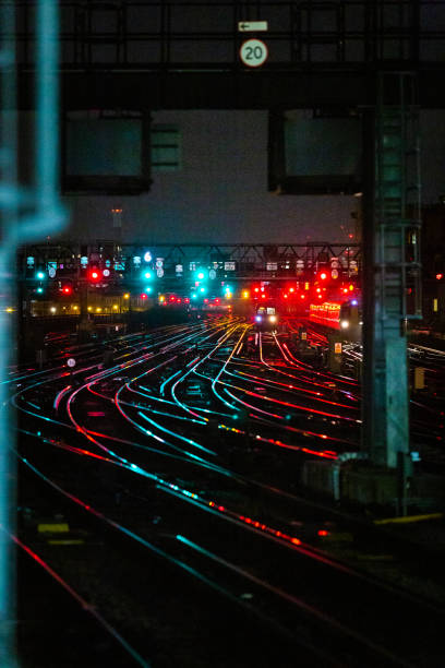 istock Railway tracks illuminated at night in the city 1309322139