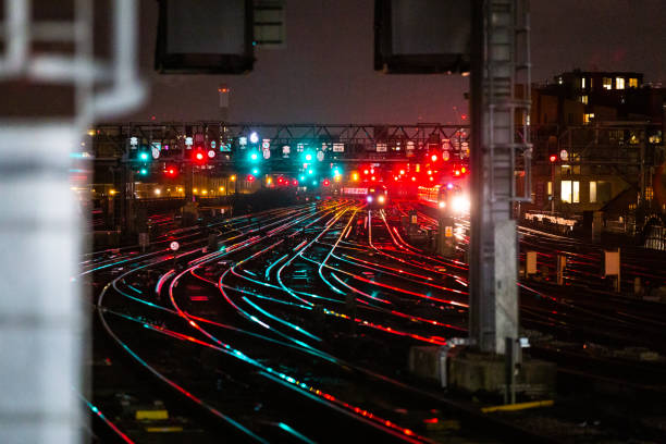 istock Railway tracks illuminated at night in the city 1309322144