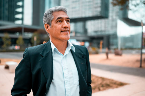 Portrait of happy businessman Happy businessman looking away business man looking away stock pictures, royalty-free photos & images