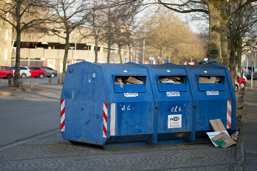 Wolfsburg,Lower Saxony , Germany 26th March 2021, recycling trash containers, garbage can for paper and carton overloaded during the curfew time