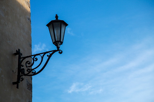Motovun city detail. Medieval building with old street lamp. Croatia.