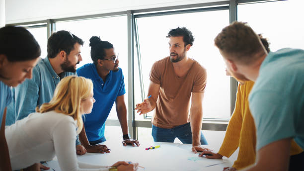 istock Group of young designers at a studio. 1309325276
