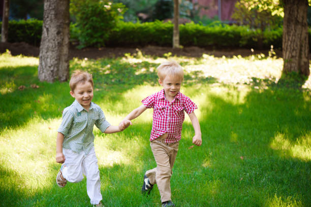 istock Two young boys walk and relax in the park. 1309326825