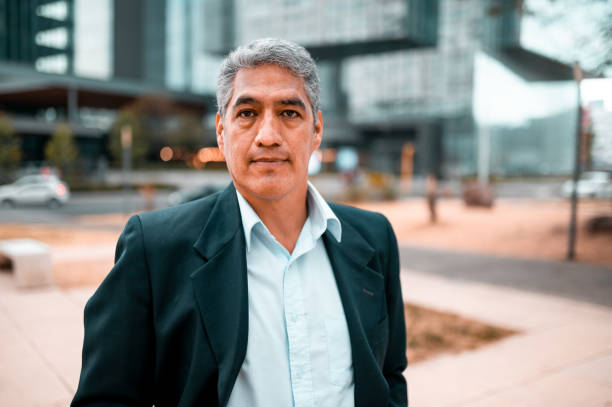 Portrait of businessman standing outdoors