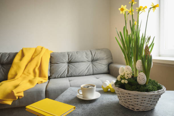 istock Spring Easter home interior in living room with cup of coffee. 1309328715