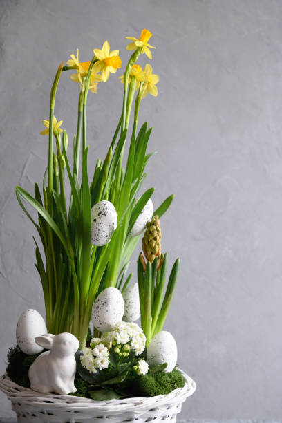 istock Easter handmade flower composition with blossom narcissus. 1309328716