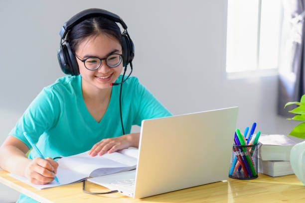 istock Asian woman student happy in class online learning 1309328727