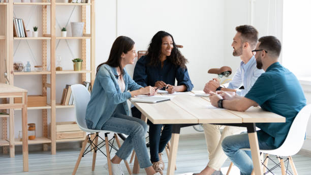 istock Banner view of smiling colleagues cooperate in office 1309328815
