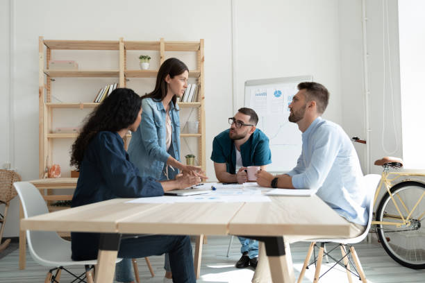 istock Focused businesspeople engaged in creative thinking at meeting 1309328818