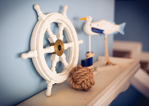 Nautical decorations on a wooden shelf