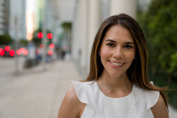 istock Successful business woman smiling on the street 1309332995