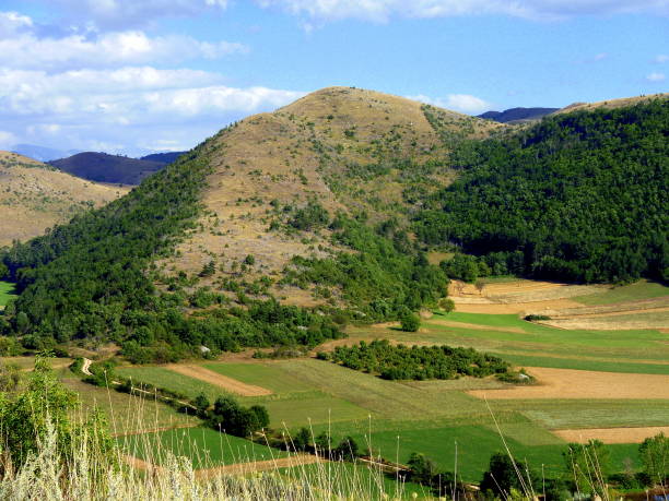 istock View from above of mountains range  and cultivated fields, Rocca Calascio, Abruzzo, Italy 1309333085