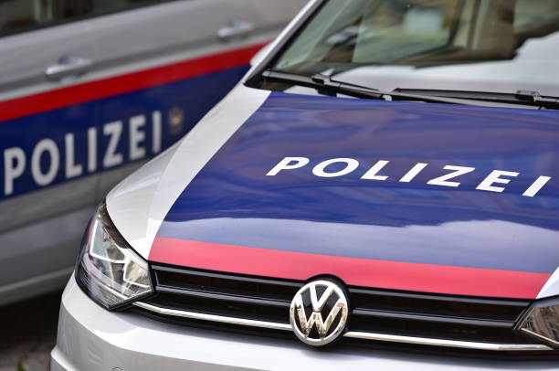 Police cars Two Police cars on a street waiting on emergency in Austria, Europe austria stock pictures, royalty-free photos & images