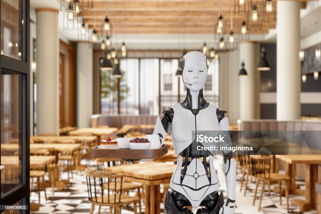 Robot Waitress Serving In A Restaurant Robot waitress serving dessert and coffee on a tray in a cafe. Robot Stock Photo