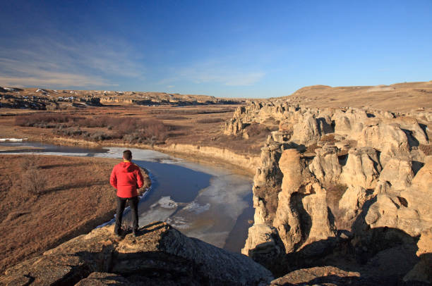 istock Man Admiring Incredible View At Writing-On-Stone Provincial Park in Alberta Canada 1309336257