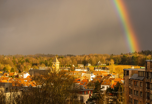 Beautiful rainbow over Brussels Woluwé-Saint-Pierre municipal Saint-Alix, also called Sint-Pieters-Woluwe, Sint Aleidis by Duch speaking natives.