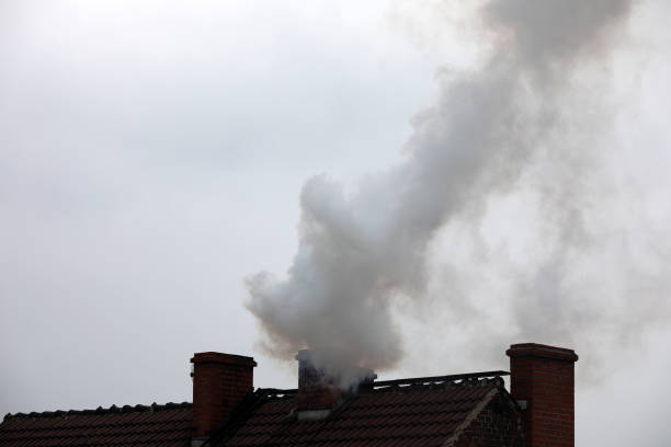 istock Smoke from the chimney forming smog which is harmful 1309346285