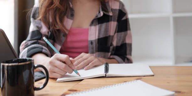 istock woman hand working with new modern computer and writing 1309349845
