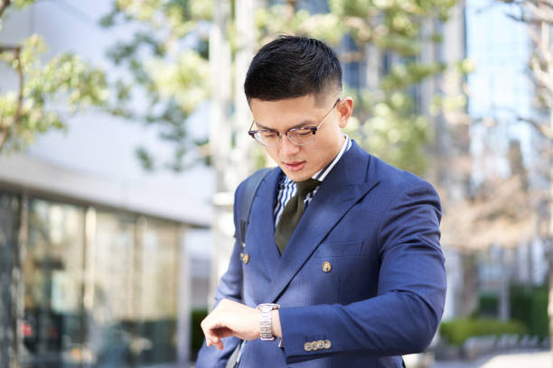 istock Asian businessman checking the time 1309351792