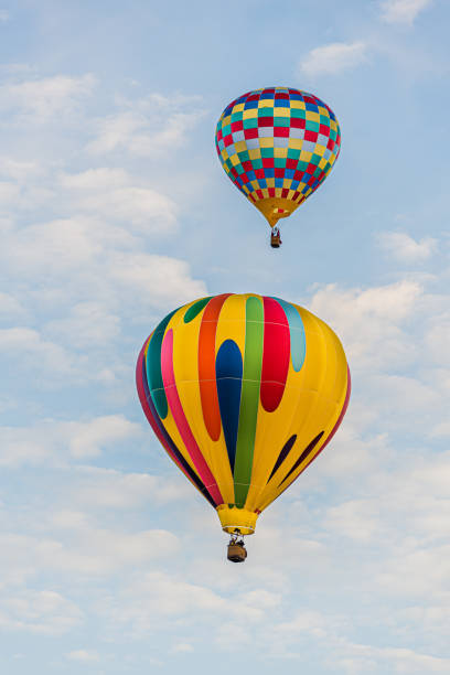 istock Two Hot Air Balloons Flying 1309357856