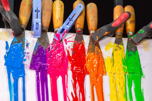 istock Different colors are dripping from the color scoop handle. 1309358543