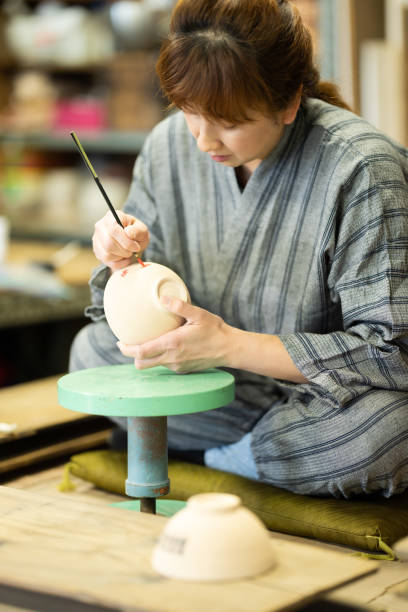 Female potter to paint