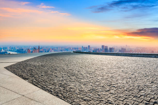 istock Empty square and city skyline at sunrise in Shanghai. 1309361249