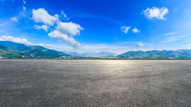 istock Race track road and green mountain in summer. 1309362128