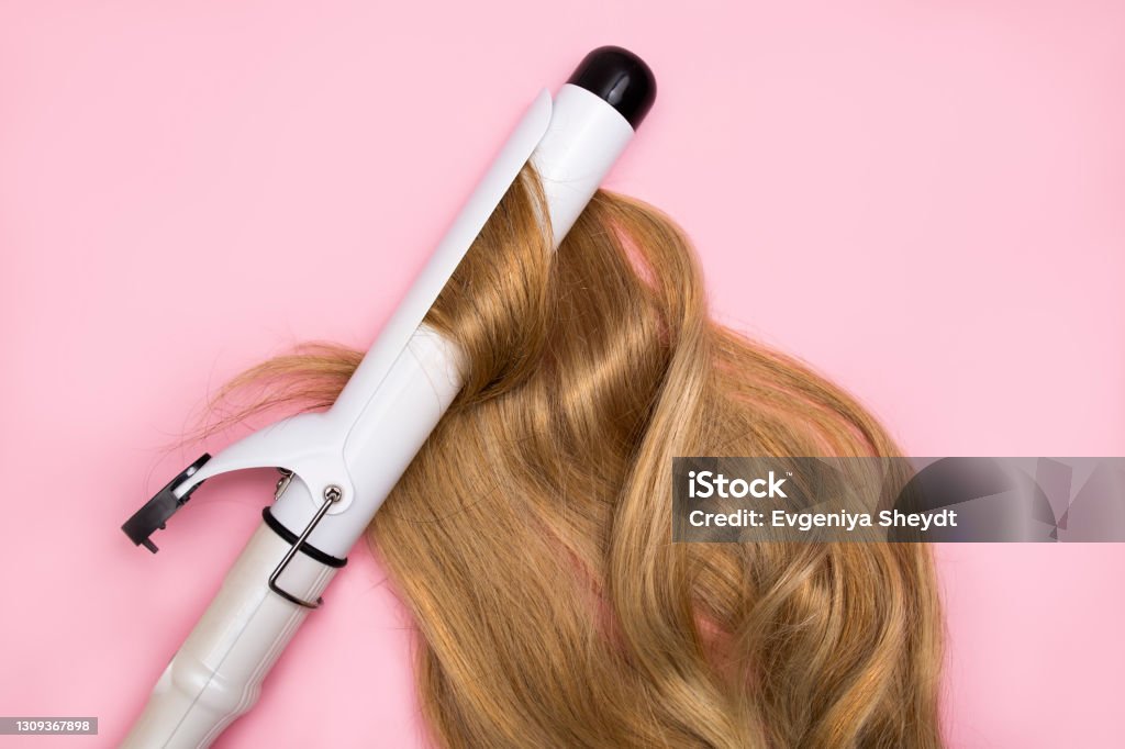 Curling Blonde Hair On A Large Diameter Curling Iron On A Pink Background  Hair Health Concept Damage By Hot Hair Styling Stock Photo - Download Image  Now - iStock