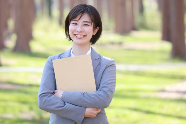istock Female employee with binder 1309373299