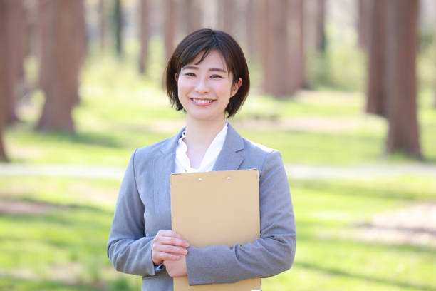 istock Female employee with binder 1309373318