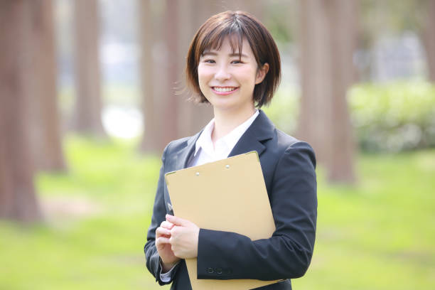 istock Female employee with binder 1309373415
