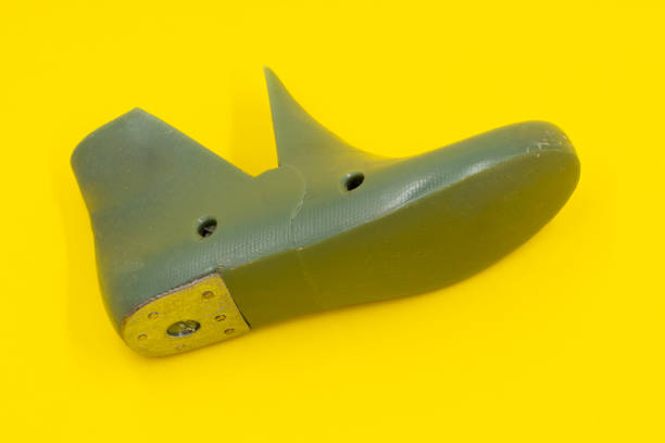 istock Green pad or form for making children's uniforms on a yellow background. Shoe industry 1309375478