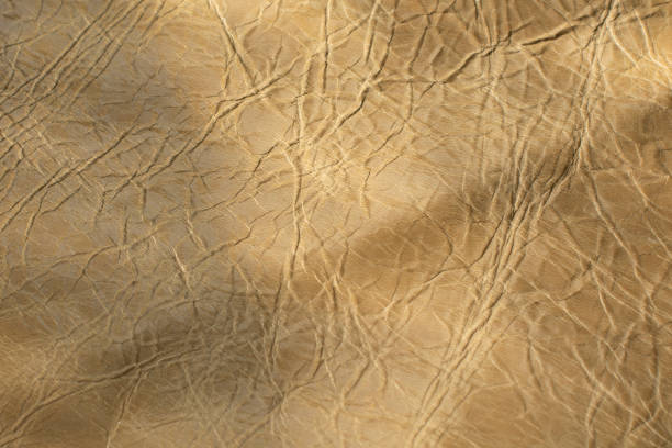 istock Beige textured leather for design template and background.Shoe industry 1309375482