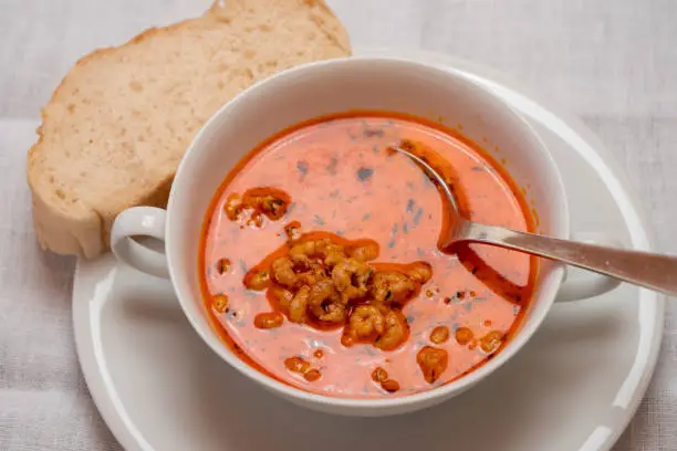 Busumer Krabbensuppe, Busom Style Soup with North Sea Crabs in a White Bowl, Served with a Slice of Bread
