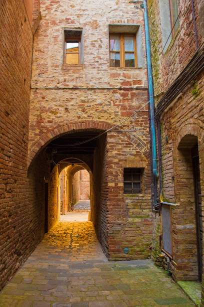 Street in Buonconvento, Tuscany A quiet residential back street in the historic medieval village of Buonconvento, Siena Province, Tuscany, Italy"n crete senesi stock pictures, royalty-free photos & images